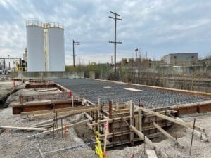 A construction site with many scaffolding and concrete.